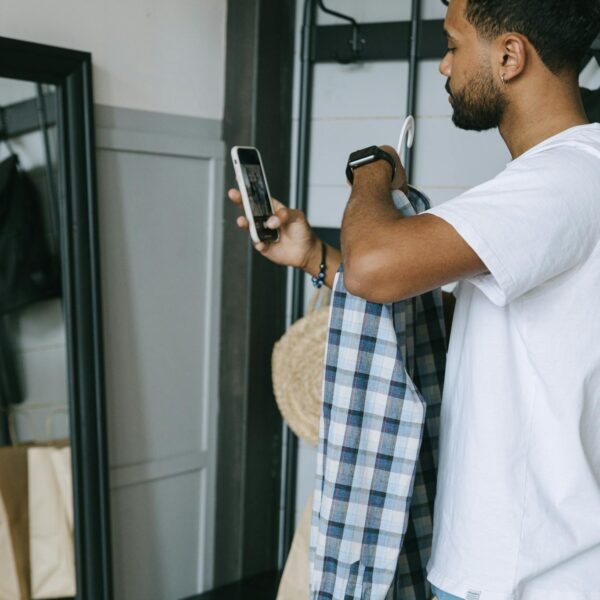 Man in White Dress Shirt Holding Smartphone